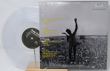 Vinyl record with a clear disc and cover featuring a silhouette of a person at a concert.