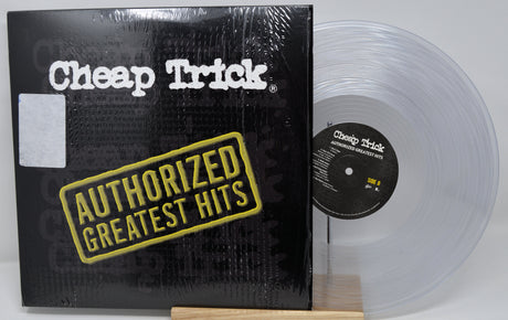 Vinyl record with 'Cheap Trick' album cover featuring clear record and black cover.