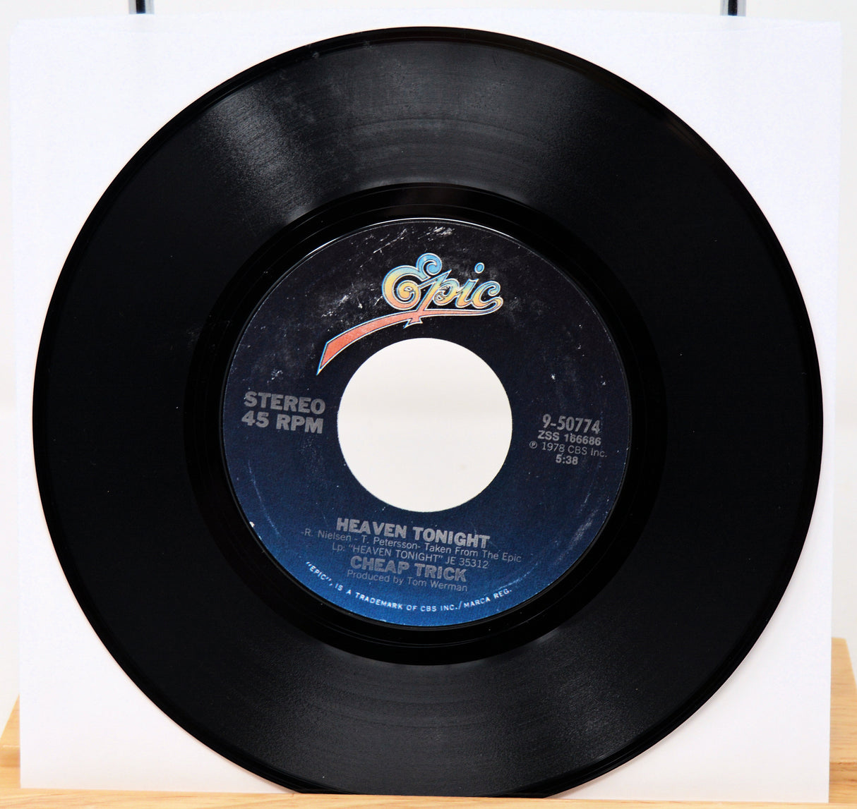 Vinyl record with a visible label on a white background