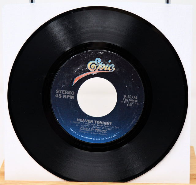 Vinyl record with a visible label on a white background