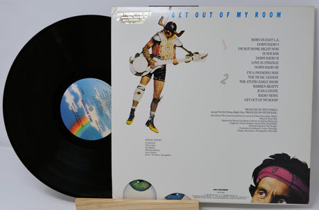 Vinyl record with colorful label and artwork on a white background