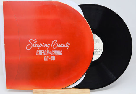 Vinyl record with red cover and black disc on a white background