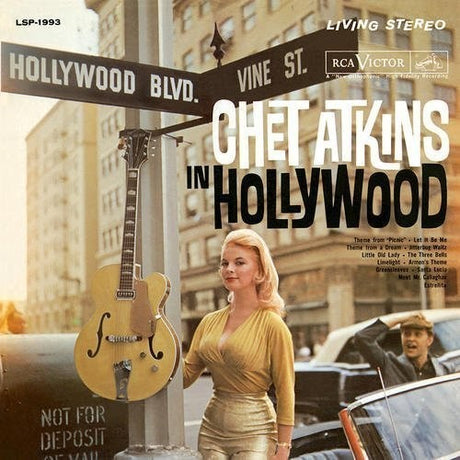 Album cover featuring a woman in a yellow dress standing next to a guitar and Hollywood street sign.