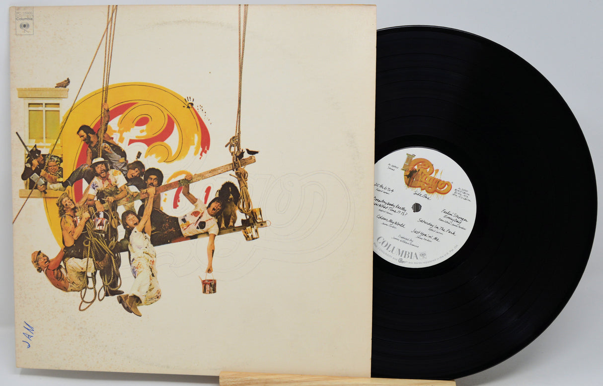 A vinyl record partially pulled from its sleeve, showing the album cover artwork and a black record on a light gray background.