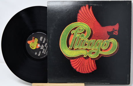 Vinyl record with 'Chicago' album cover featuring a red bird logo.