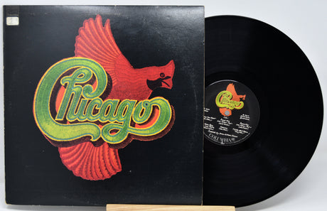 Vinyl record with 'Chicago' album cover featuring a red bird logo.