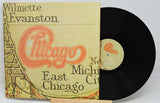 Vinyl record with a cover featuring 'Chicago' and text on a white background