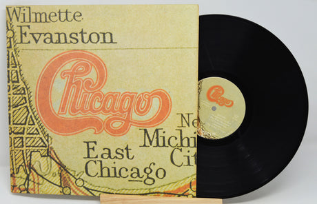 Vinyl record with a cover featuring 'Chicago' and text on a white background