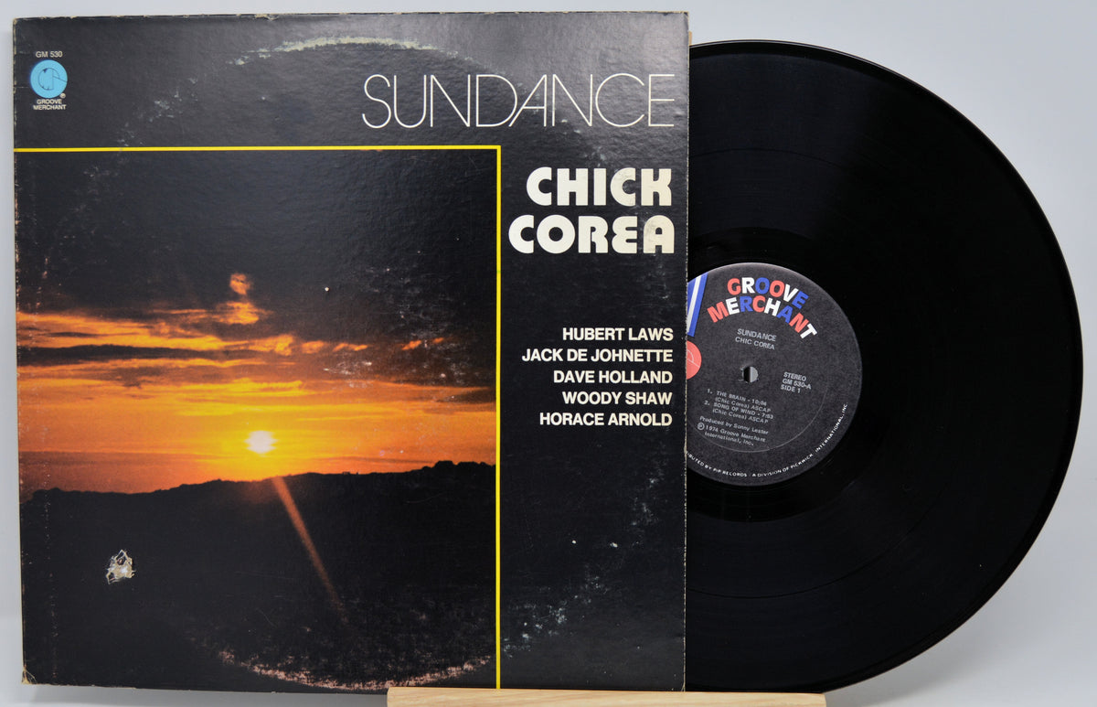 Chick Corea's 'Sundance' vinyl record album with the cover standing beside the black LP on a light gray background.