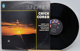 Chick Corea's 'Sundance' vinyl record album with the cover standing beside the black LP on a light gray background.