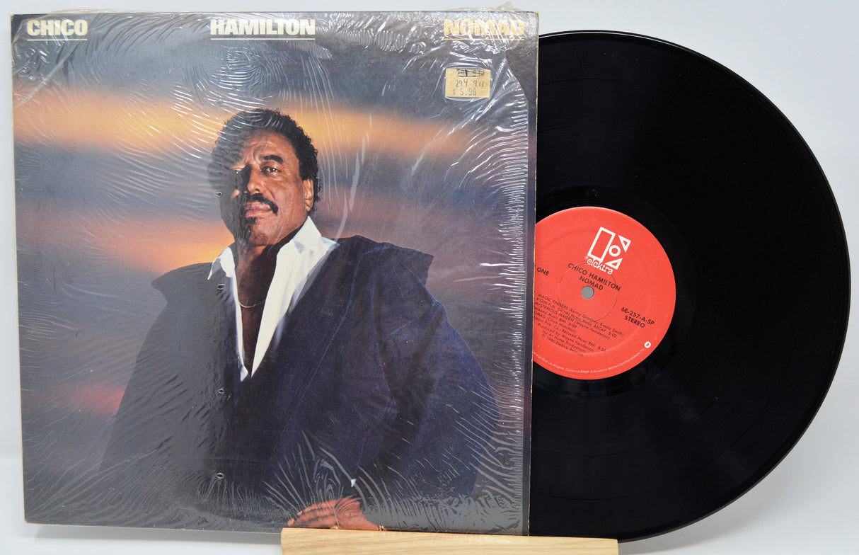 Vinyl record with cover featuring a person, on a white background