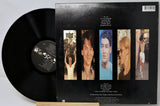 Vinyl record with a black cover featuring images of a person and text on a light gray background