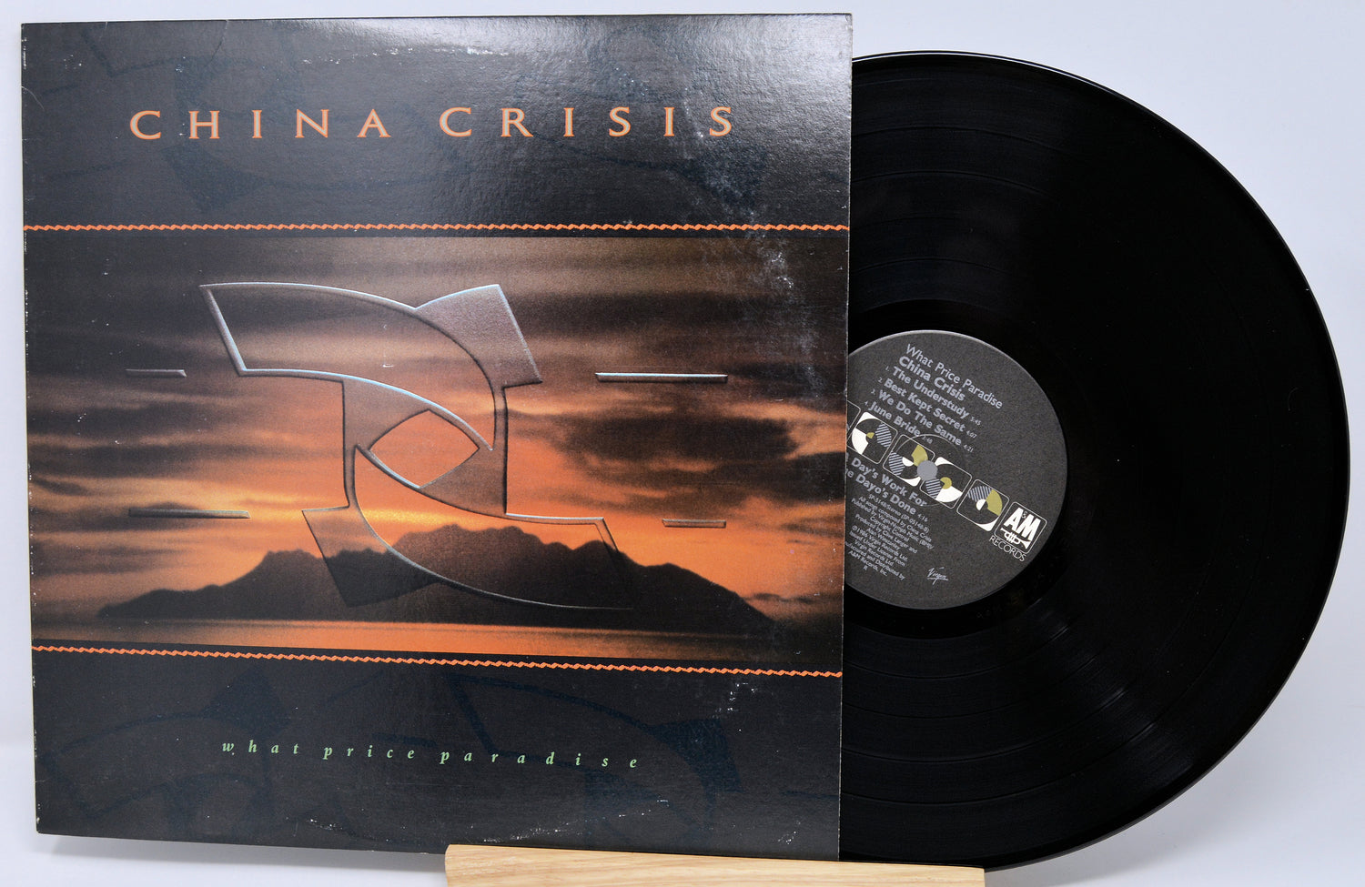 Vinyl record with cover titled 'China Crisis' on a light gray background
