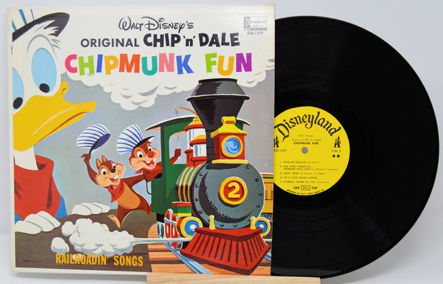 Vinyl record with 'Chip 'n' Dale Chipmunk Fun' cover featuring cartoon characters and a train.
