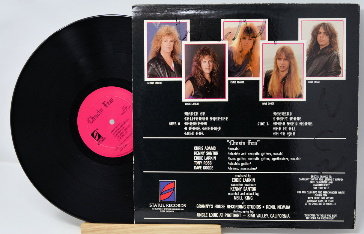Vinyl record with a black cover featuring album artwork and text.