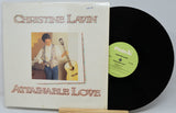 Vinyl record with cover featuring 'Christine Lavin Attainable Love' on a white background