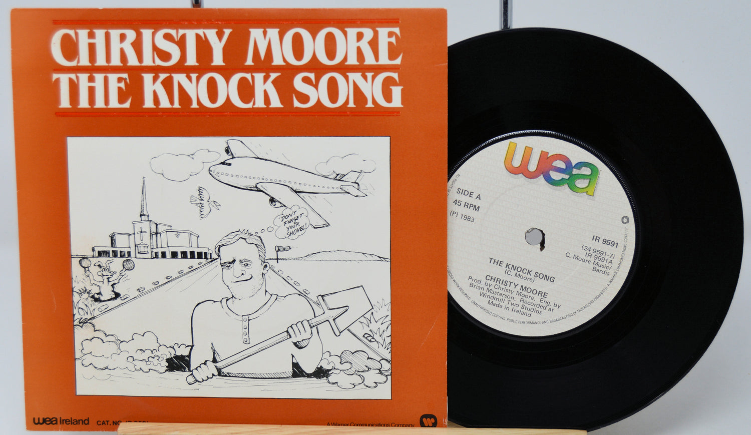 Vinyl record and cover with 'The Knock Song' by Christy Moore on a white background