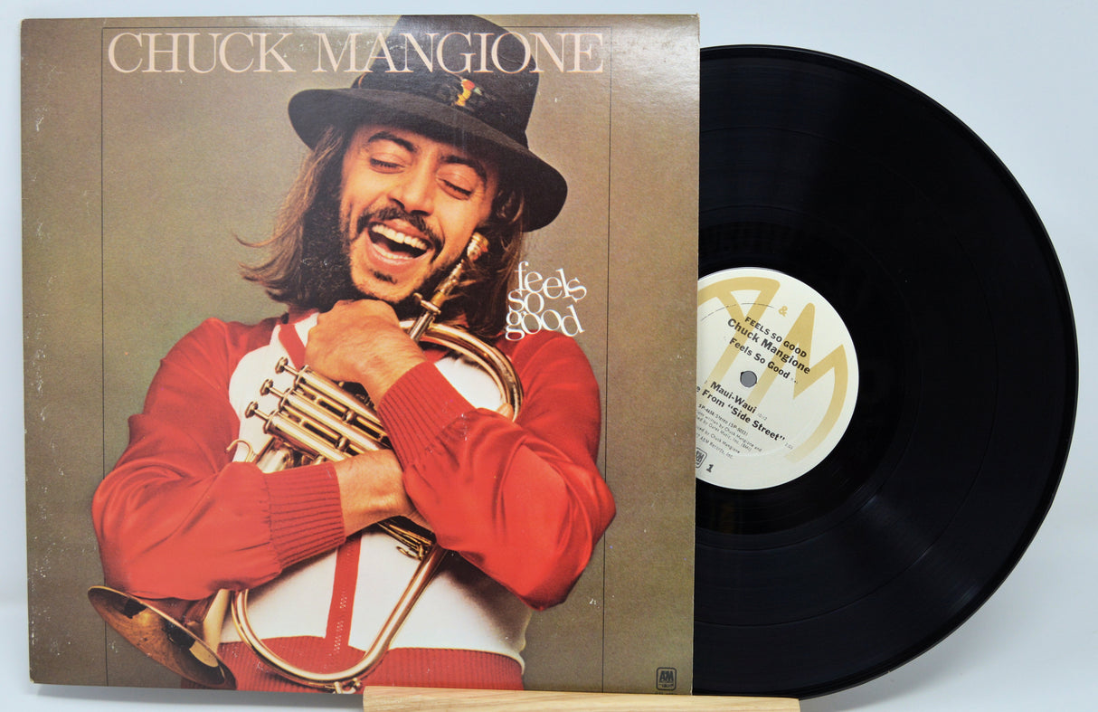 Vinyl record with cover featuring Chuck Mangione holding a trumpet, titled 'Feels Good'.