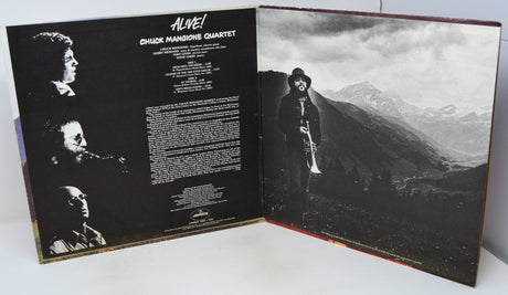 Album cover with black and white images of a musician and text on a mountainous landscape.