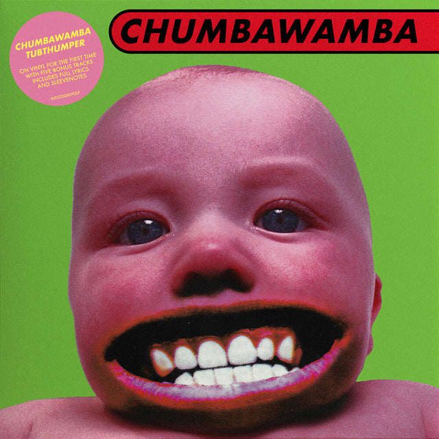 Chumbawamba album cover featuring a close-up of a baby's face with an open mouth showing teeth, set against a bright green background with the band name 'CHUMBAWANDA' in a red banner at the top and a pink circular sticker on the upper left.