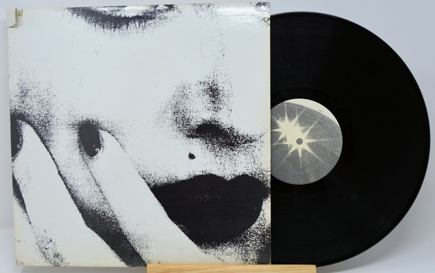 Ciccone Youth The Whitey Album alternate sleeve artwork with a stylized face and vinyl record