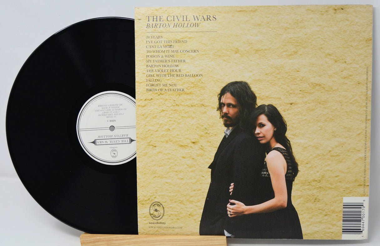 Vinyl record and its cover featuring 'The Civil Wars' on a light gray background