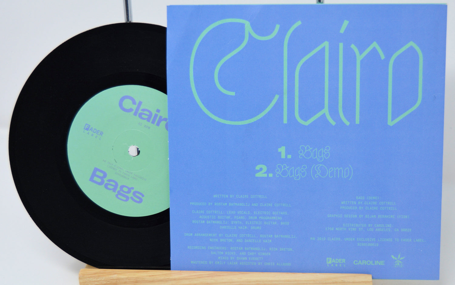 Vinyl record with a blue cover featuring the name 'Clairo' and track listings.