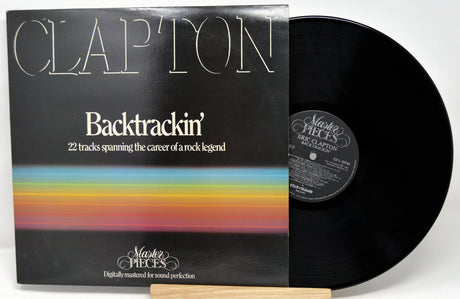 Vinyl record with cover featuring 'Clapton' and 'Backtrackin'' on a white background