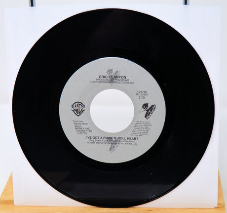Vinyl record with a white label featuring text and logos on a white background