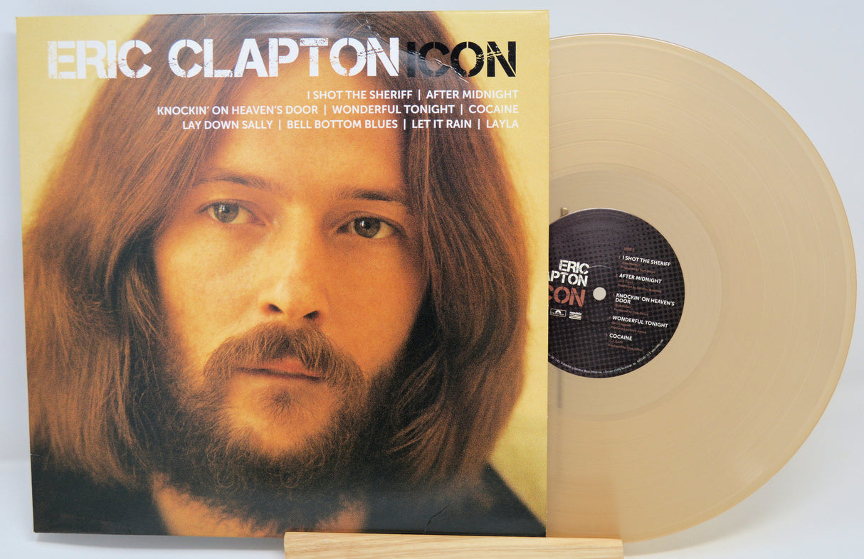 Vinyl record with cover featuring a portrait of Eric Clapton on a white background