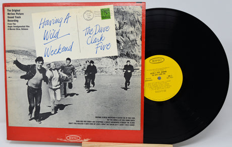 Vinyl record with cover featuring a group of people and text, on a white background