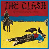 Album cover of 'The Clash - Give Em Enough Rope' with an illustration of a person lying down and another person on a horse against a colorful background.