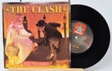 Vinyl record and cover of 'The Clash - Rock The Casbah' on a white background