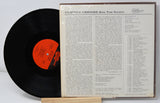 Back cover and vinyl record of Clifton Chenier's Bon Ton Roulet LP showing tracklist and album notes