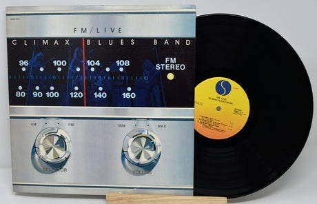 Vinyl record with a cover featuring an FM radio design.