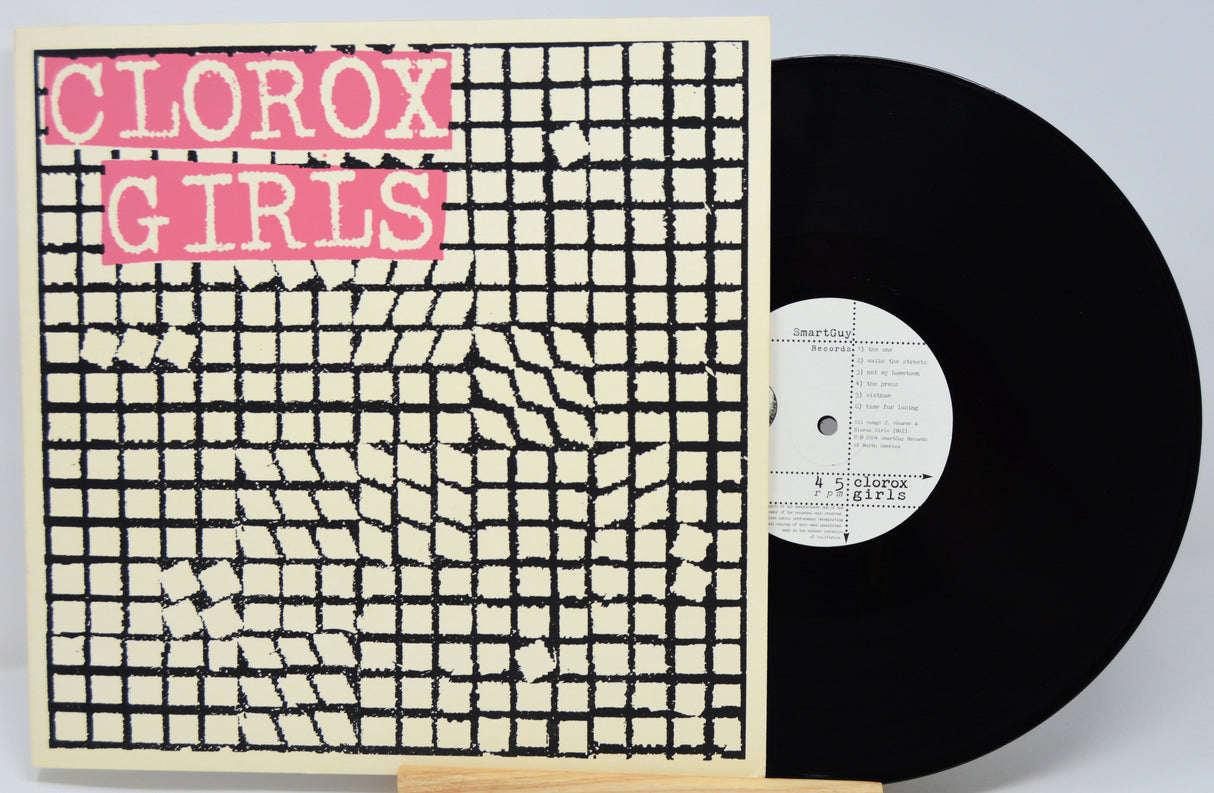 Vinyl record with a cover featuring 'Clorox Girls' text on a grid pattern.