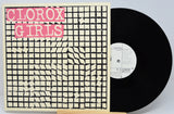 Vinyl record with a cover featuring 'Clorox Girls' text on a grid pattern.