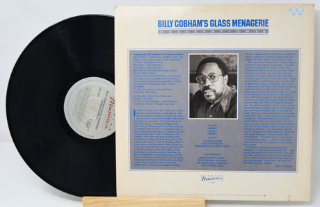 Vinyl record with cover featuring a portrait and text on a white background