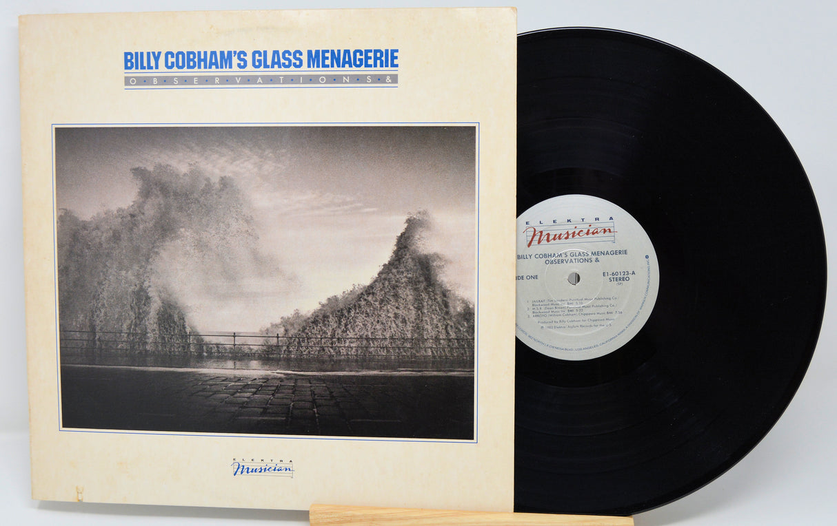 Vinyl record and cover of 'Billy Cobham's Glass Menagerie' on a light gray background