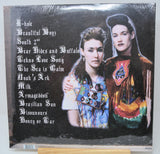 Back cover of CocoRosie's Noah’s Ark vinyl listing album tracks and artists in creative attire