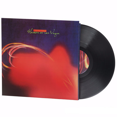 Album cover art for Cocteau Twins - Heaven Or Las Vegas featuring an abstract design with red and blue hues.