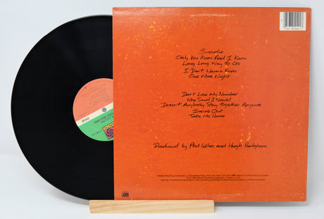 Phil Collins vinyl record 'No Jacket Required' back cover with song titles in text.