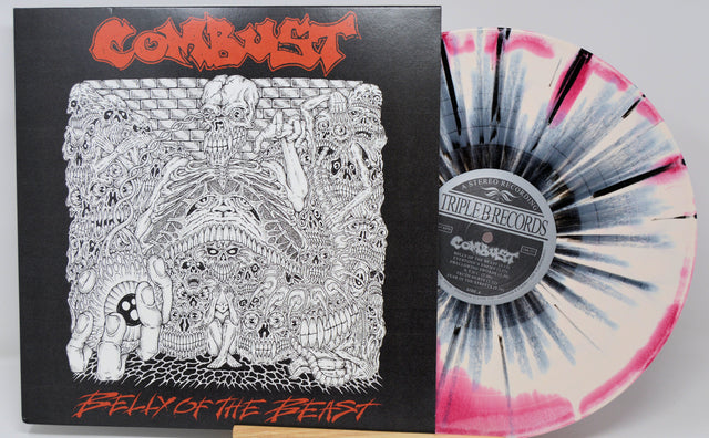 Combust Belly of the Beast vinyl with white and black splatter next to detailed horror-themed album art