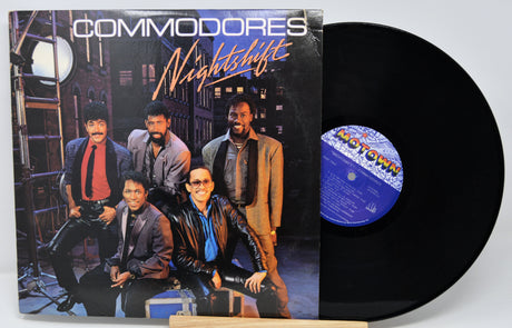 Vinyl record with cover featuring a group of people and the title 'Nightshift' by Commodores.