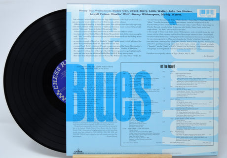 Vinyl record 'Compilation The Blues Volume 1' with a blue cover featuring text and album details.