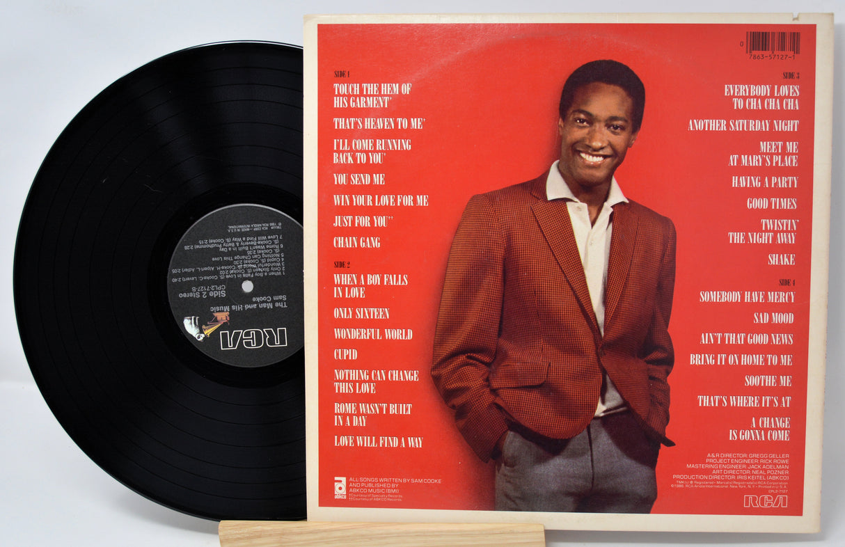 Vinyl record with a red cover featuring a man in a suit on a white background