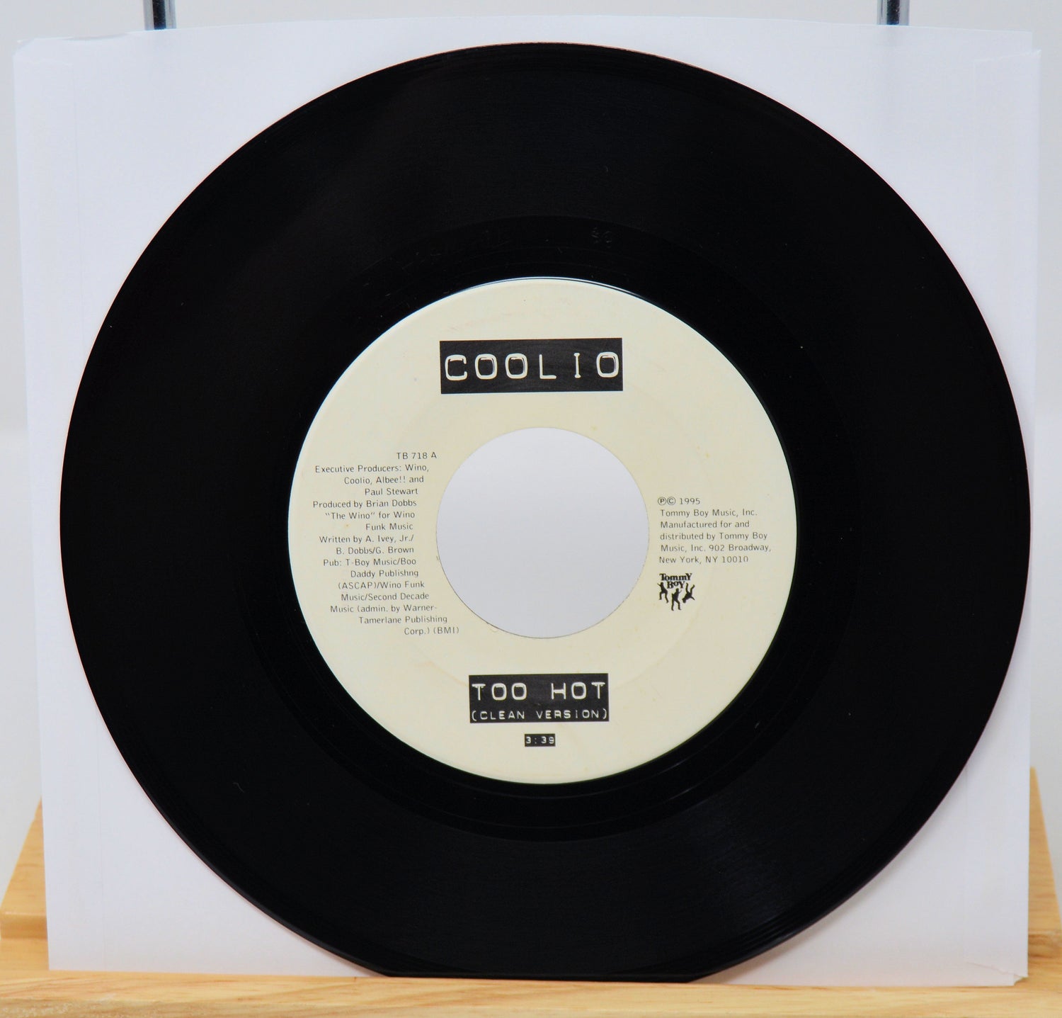 Black vinyl record with a white label on a white background