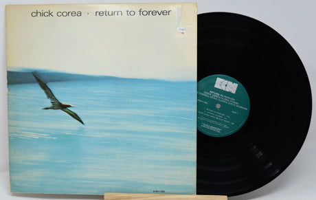 Vinyl record with cover featuring a bird over water and 'Chick Corea Return to Forever' text.