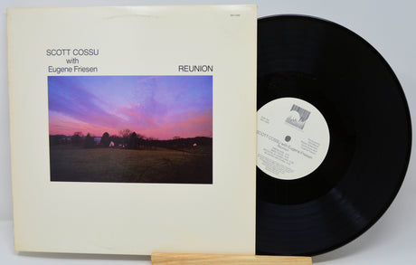 Vinyl record with cover featuring a sunset over a field and text 'Scott Cossu with Eugene Friesen Reunion'.