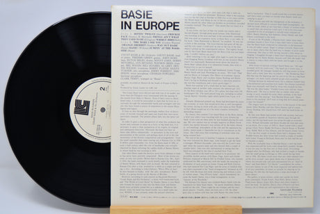 Vinyl record with 'Basie in Europe' cover on a light gray background